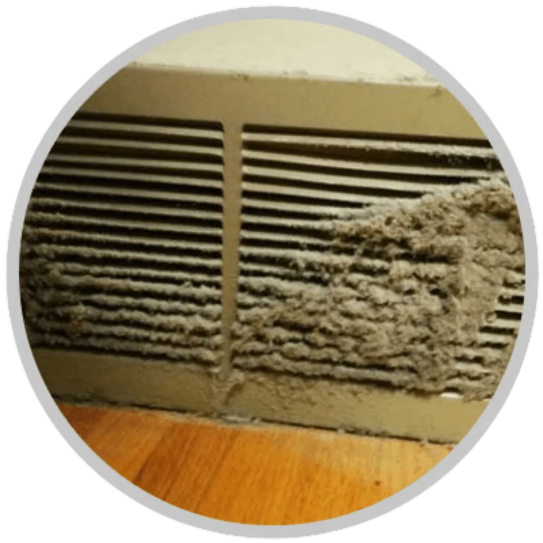 Dust and debris collecting inside a dirty air duct.